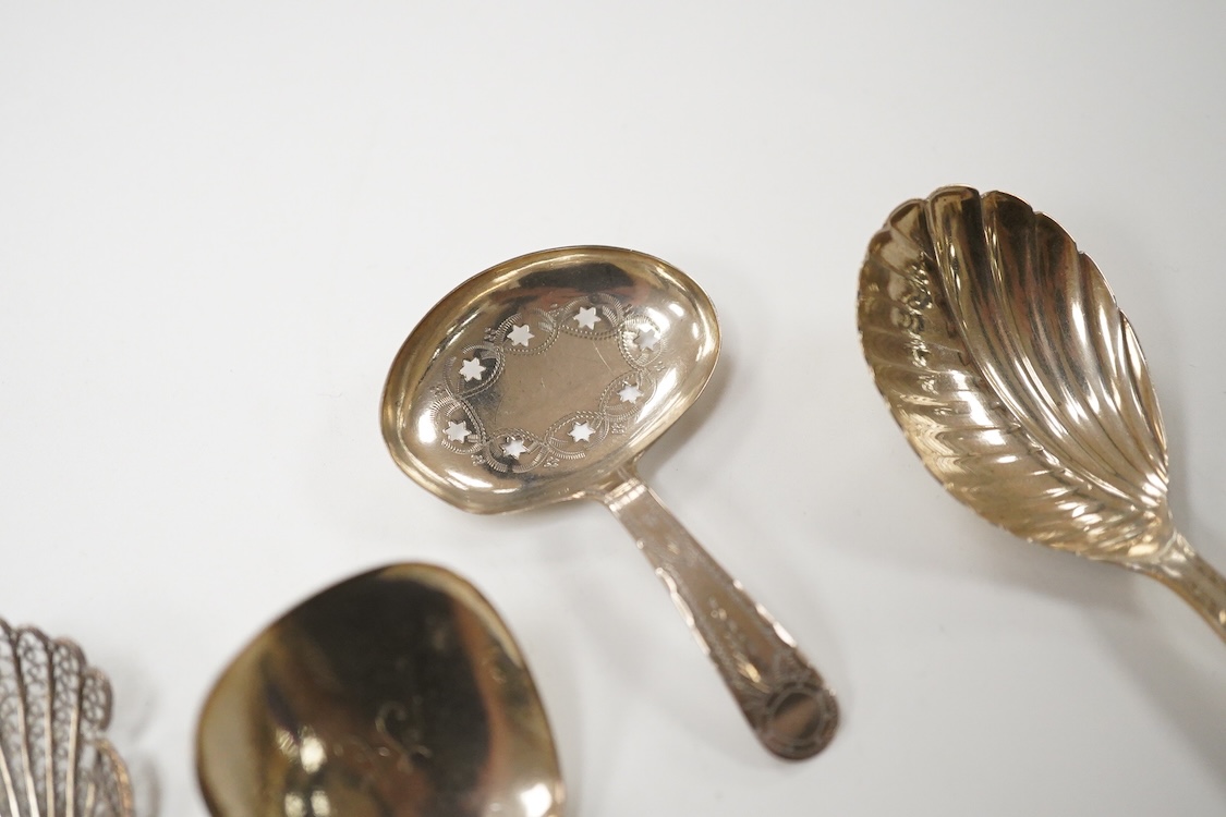 Three assorted silver caddy spoons, including star cut bowl by John Thropp, Birmingham, 1817, 69mm, hourglass? pattern, Joseph Wilmore, marks rubbed, bright cut engraved handle London, 1856 and a filigree white metal spo